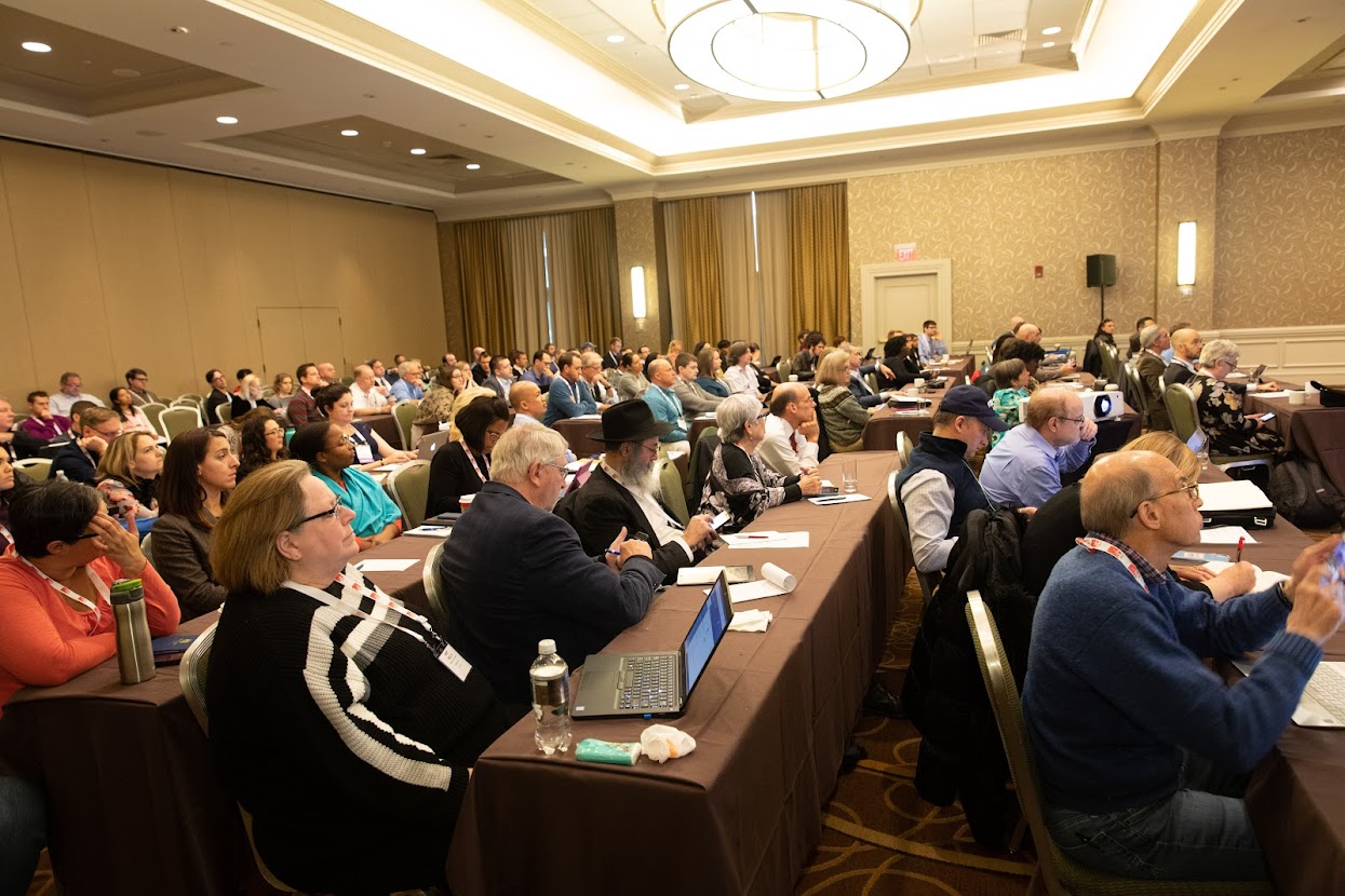 conference attendees at an NCLC conference session