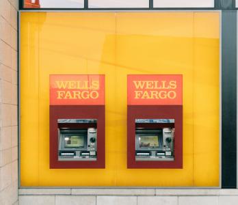 image of Wells Fargo ATMs on a yellow wall